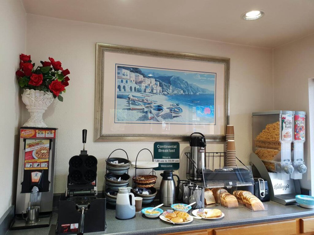 SLO INN continental breakfast with waffle maker, coffee, and cereals in San Luis Obispo