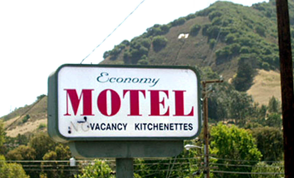 Entry sign of Economy Motel