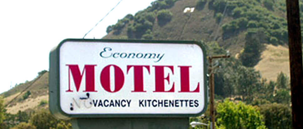 Welcome sign of Economy Motel in San Luis Obispo, California