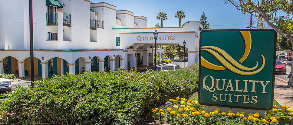 Welcome sign and front of Quality Suites Downtown San Luis Obispo