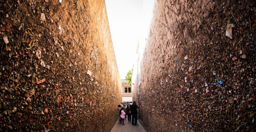 People exploring Bubblegum Alley in San Luis Obispo