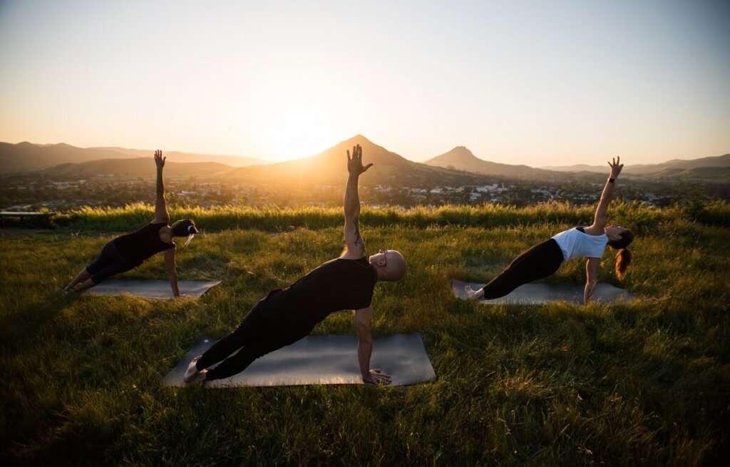 People doing yoga at sunset on Terrace Hill in San Luis Obispo, California