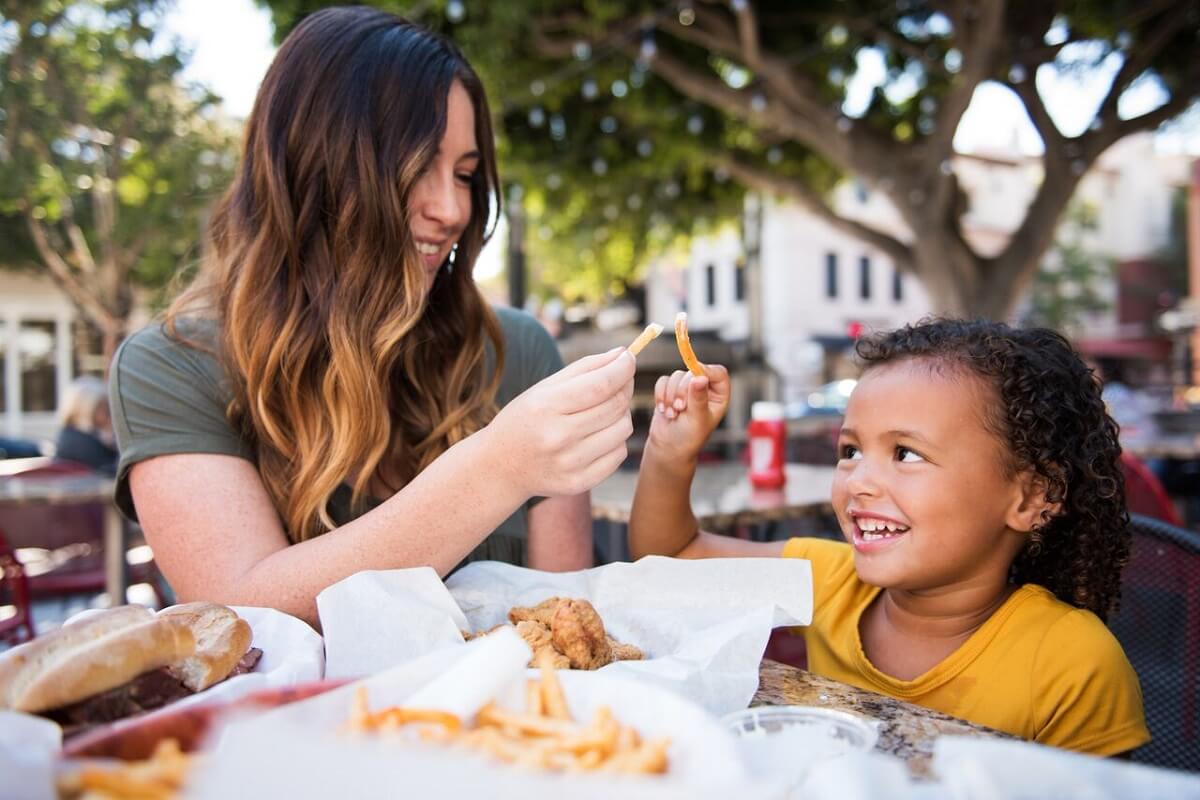 A family enjoying fries at Firestone Grill in SLO