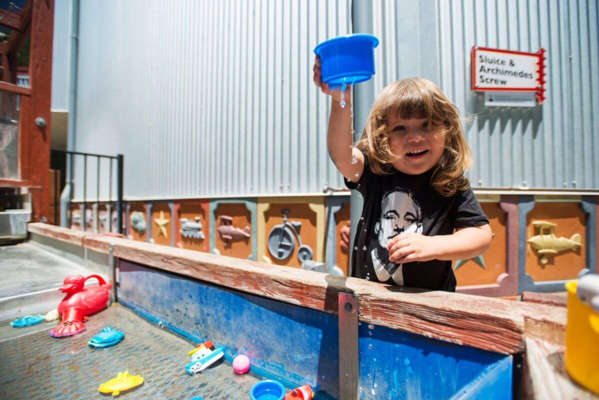 Playing with water outside at the SLO Children's Museum