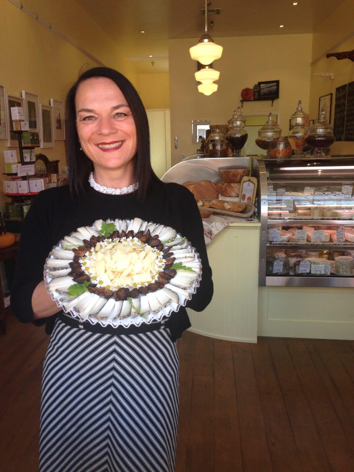 Fromagerie Sophie owner with a plate of cheese in SLO