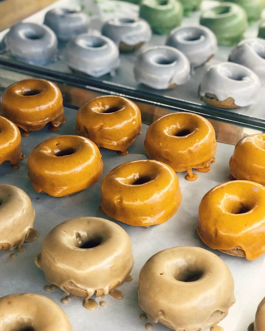 Gluten-Free Donuts with icing on trays