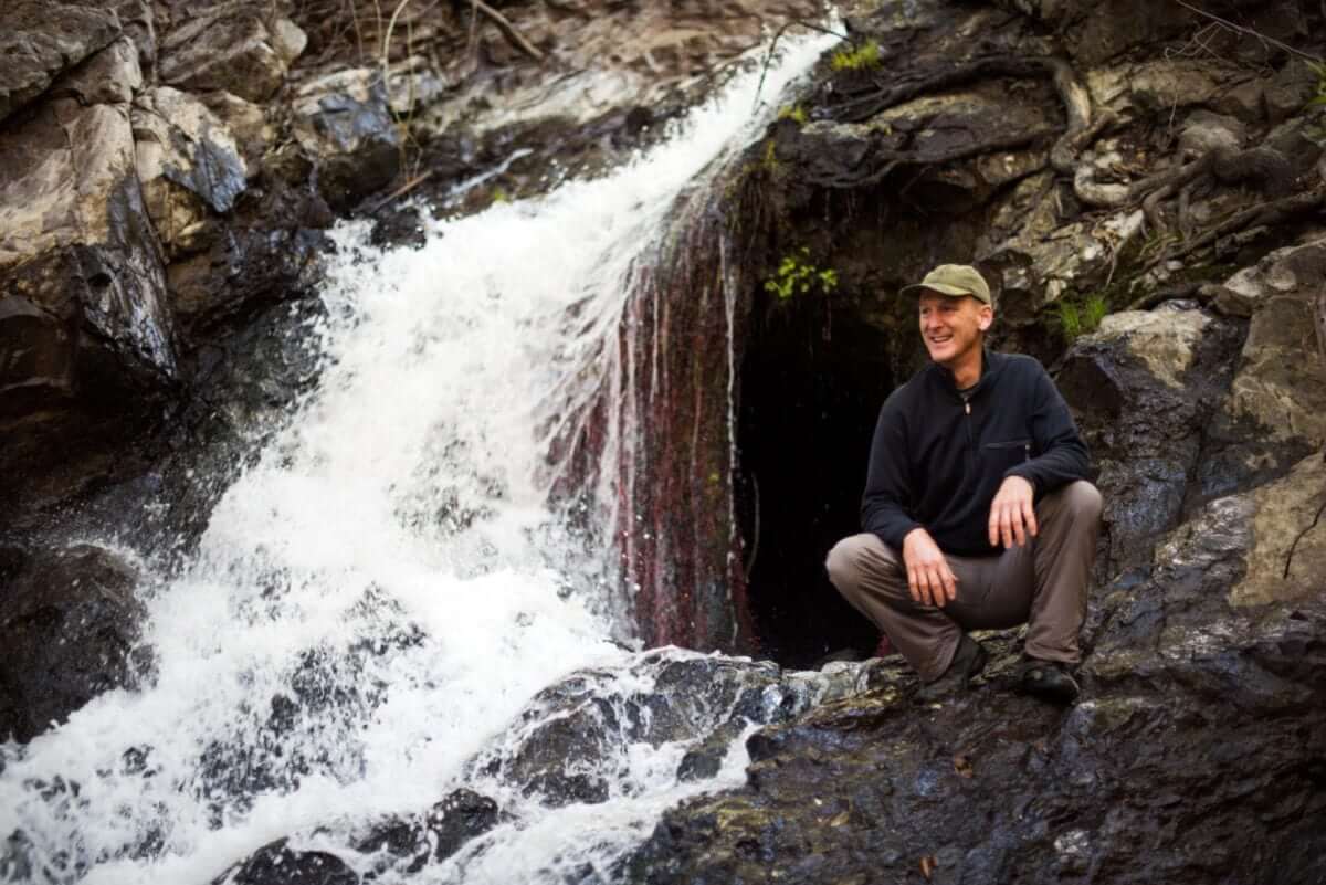 Reservoir Canyon Trail Waterfall Crouched and smiling