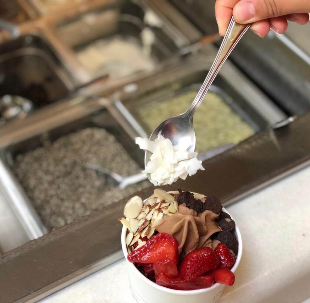 Adding toppings to soft serve from Bliss Cafe in SLO