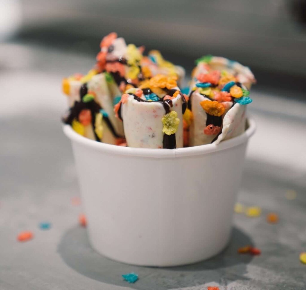 Rolld SLO Ice Cream Cup with Fruity Pebbles and Chocolate Syrup