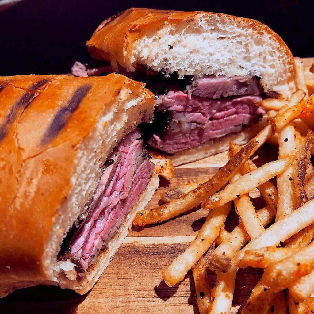 A BBQ Tri-Tip Sandwich with french fries from The Rib Line BBQ in San Luis Obispo