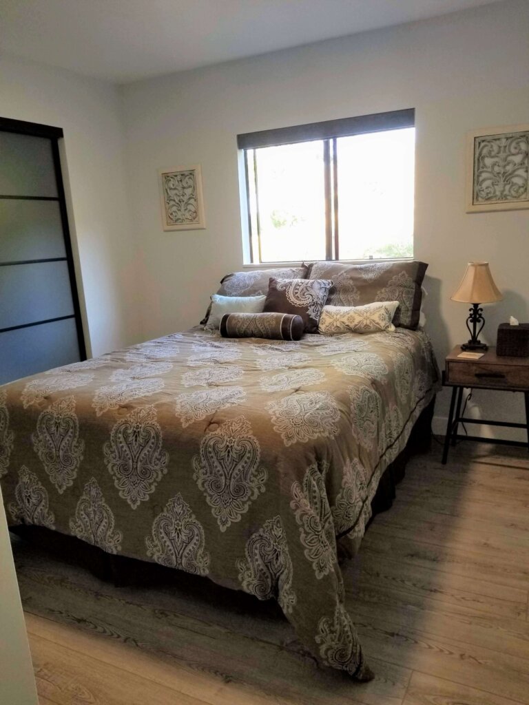 Bluerock Retreat Homestay Bedroom bed and window in San Luis Obispo