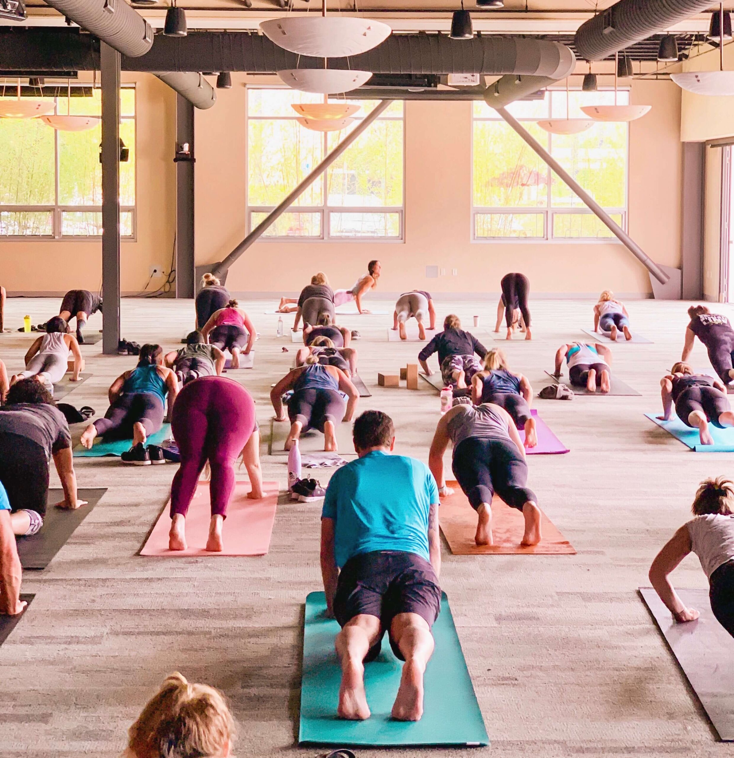 A bright, open yoga class at Mindbody in San Luis Obispo