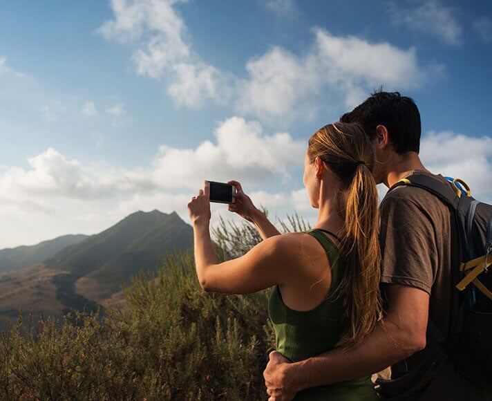 couple on a hike taking a selfie