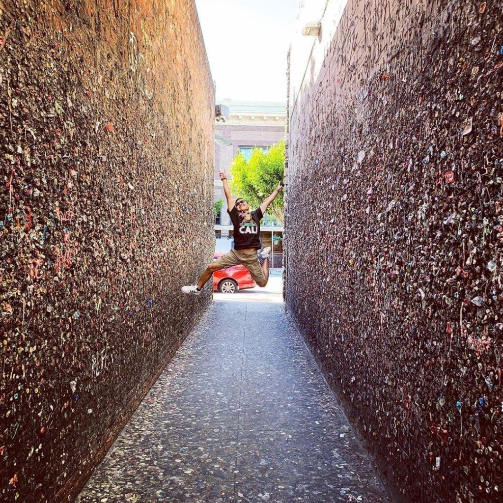 A jumping man in the middle of Bubblegum Alley in San Luis Obispo. Photo by @justparked