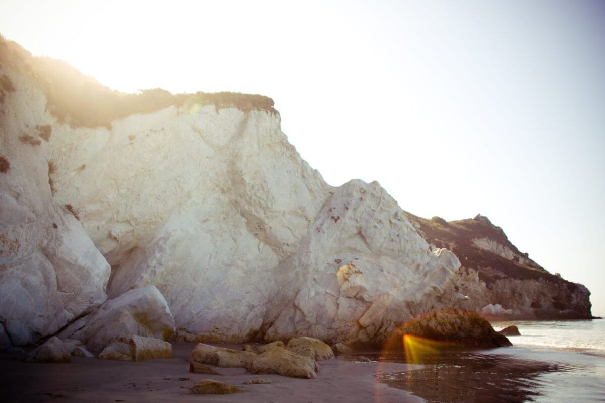 a giant white rock on the beach