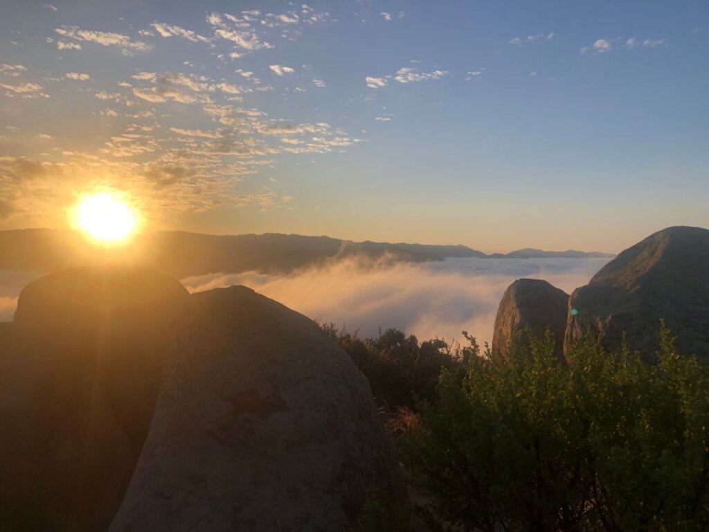 Cerro San Luis Sunrise over the mountains and cloud layer.
