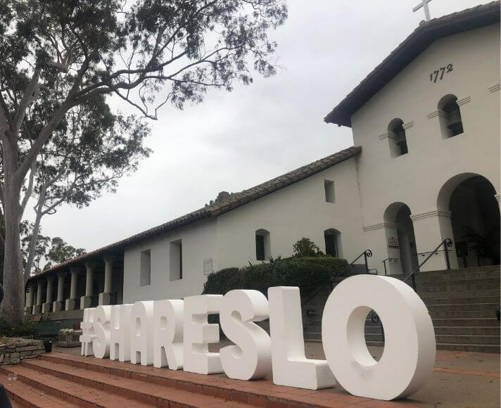 #ShareSLO Spelled out in front of the San Luis Obispo Mission