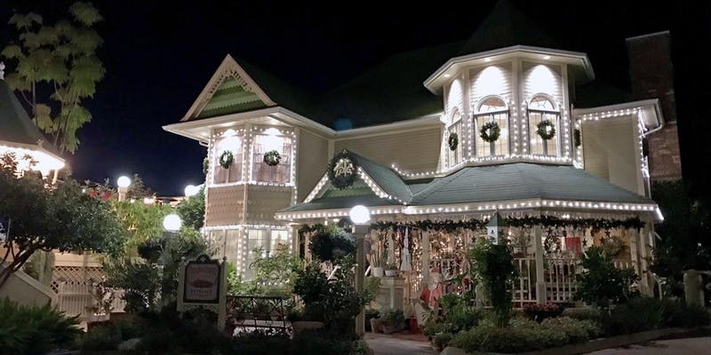 Apple Farm exterior on a dark night with holiday lights.