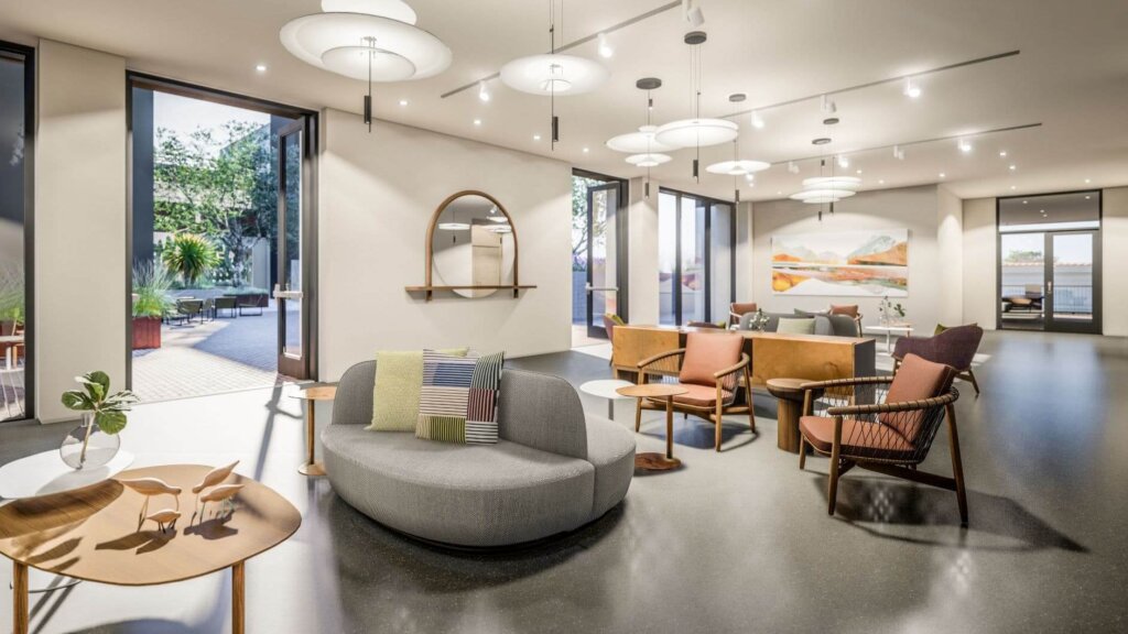The open, naturally-lit indoor sitting area of the Hotel San Luis Obispo lobby