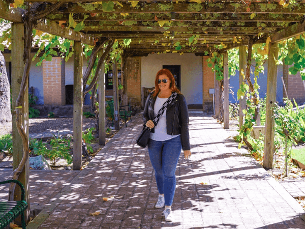 Kate in the garden area of San Luis Obispo de Tolosa.