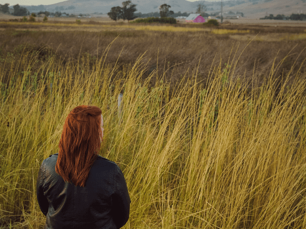 Girl looking out at Pink Barn in San Luis Obispo