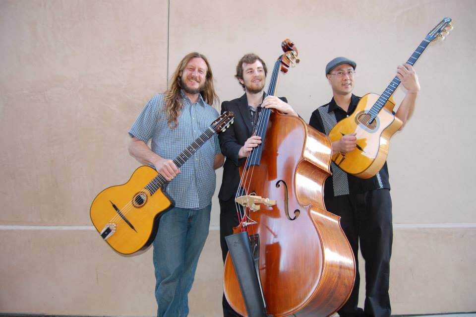 The 3 members of The Gypsy All Stars with their guitars and cello.