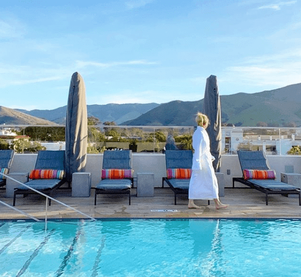 Woman walking by a pool in San Luis Obispo 