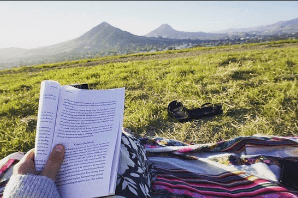 Person reading on Terrace Hill in San Luis Obispo