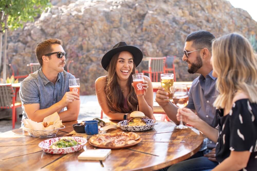 friends gather at a restaurant in san luis obispo