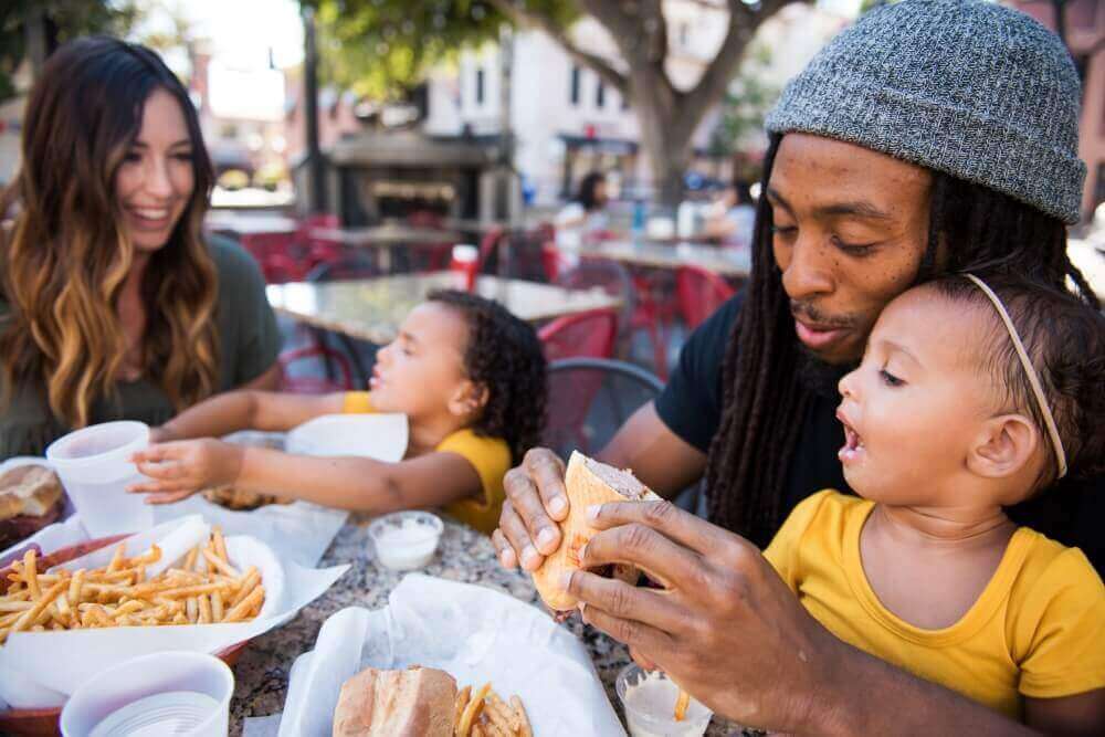 family eating outdoors at one of the places to eat in san luis obispo