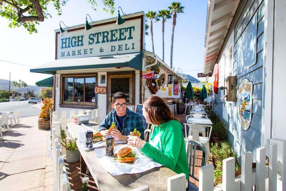 high street market guests enjoying food in slo