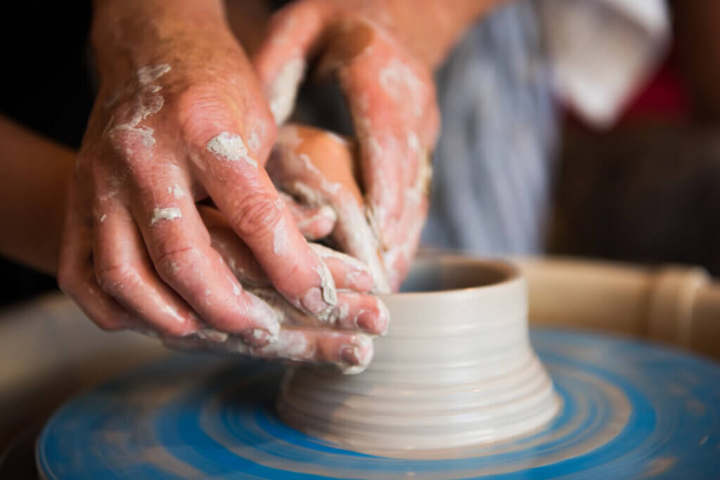 Hands doing pottery