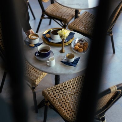 abstract photo of Anderson Social table with coffee and pastries