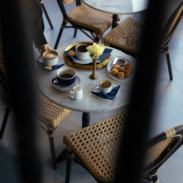 abstract photo of Anderson Social table with coffee and pastries