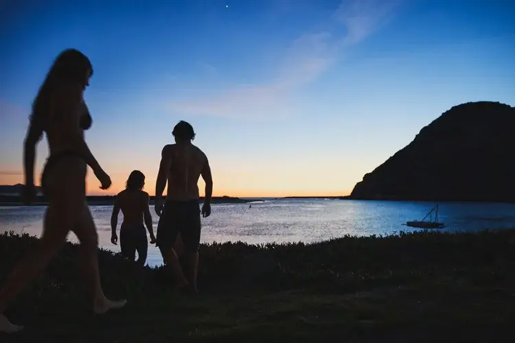 people-walking-into-water-morro-bay